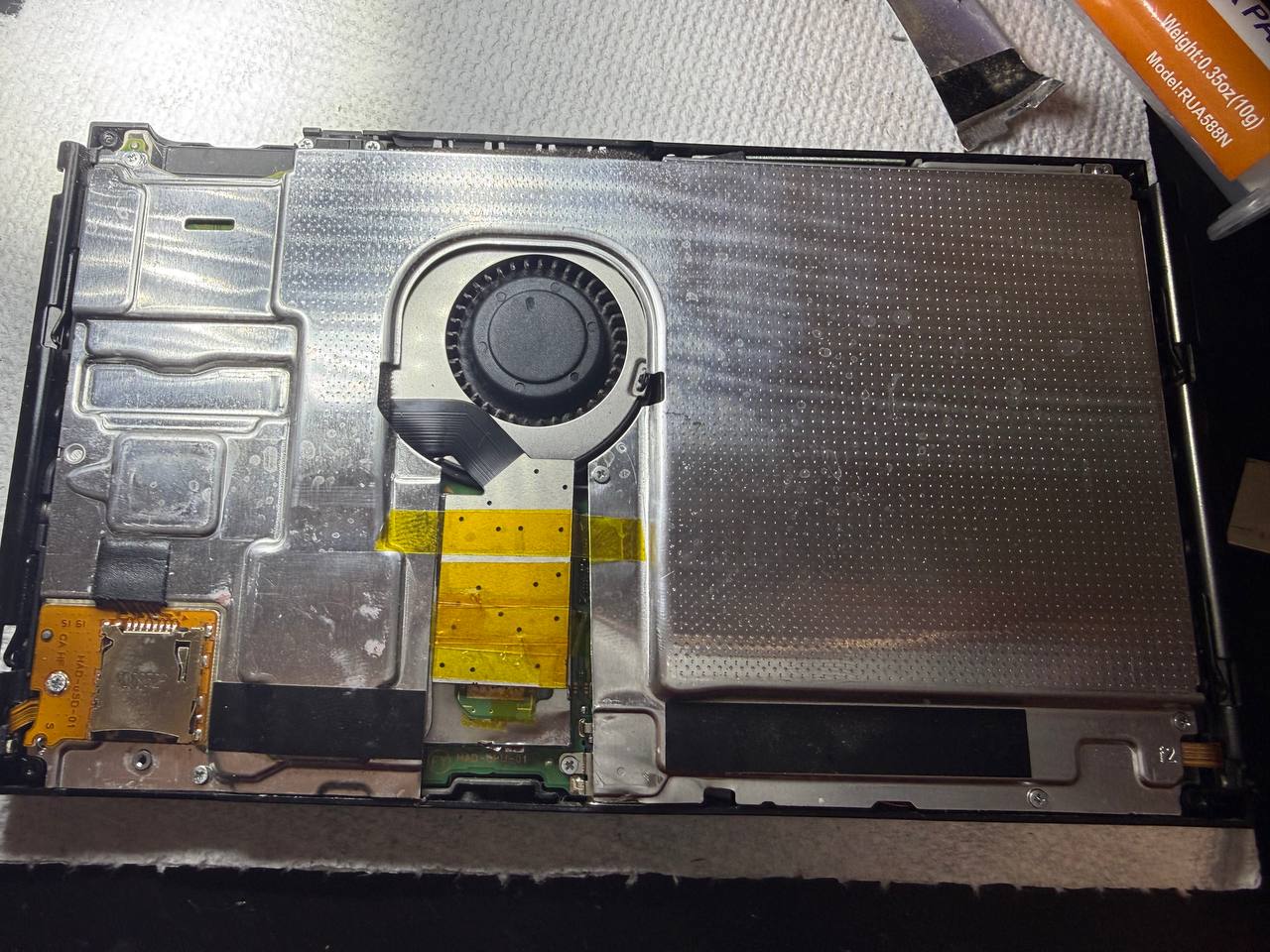 Console opened on the bench during Nintendo Switch modding and internal hardware work.